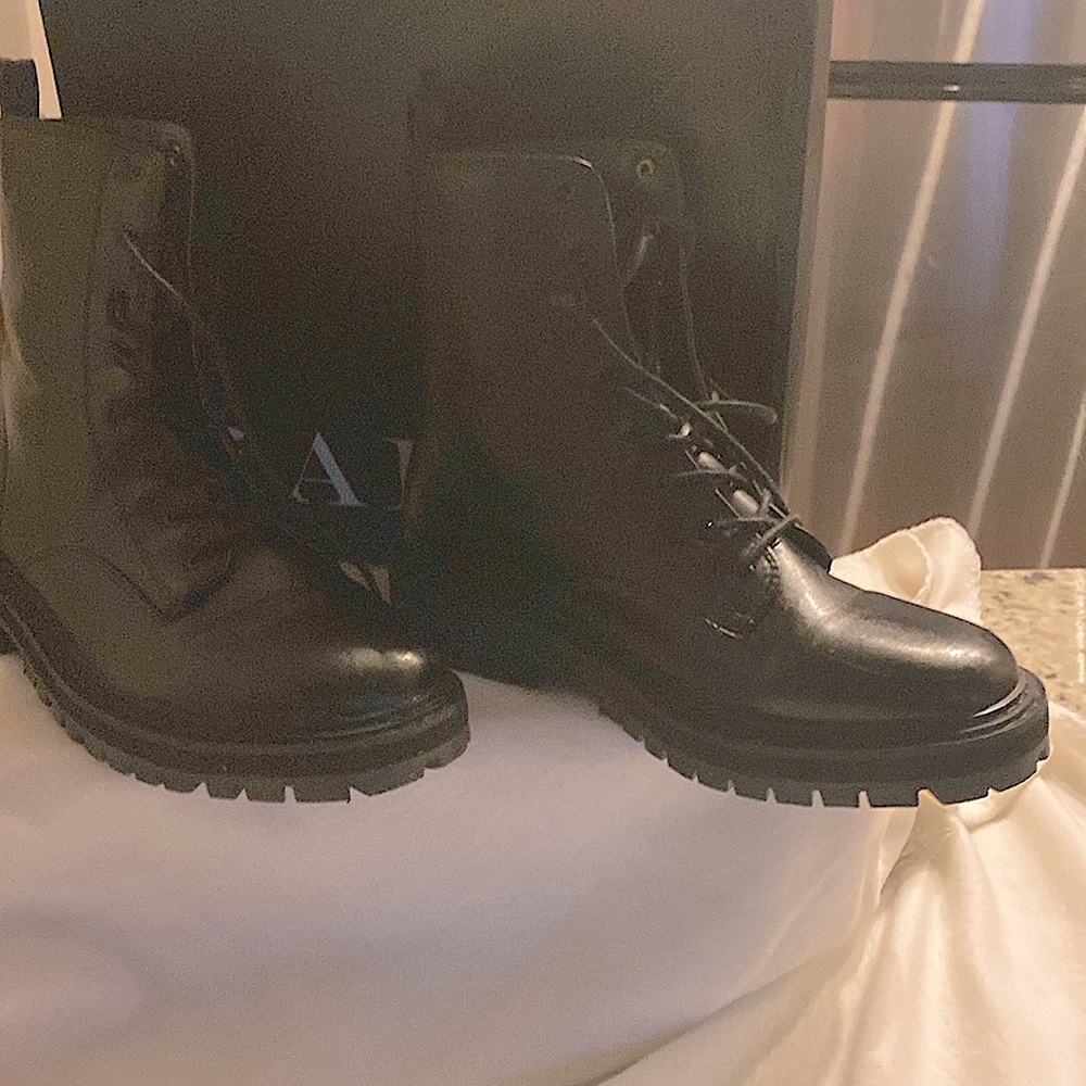 Women Black lace up boots.